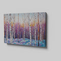 Framed canvas print of a vibrant geometric mosaic depicting an abstract birch forest with coloured leaves and sunset backdrop