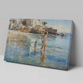 Framed canvas print of a sunlit Mediterranean beach with a mother and child