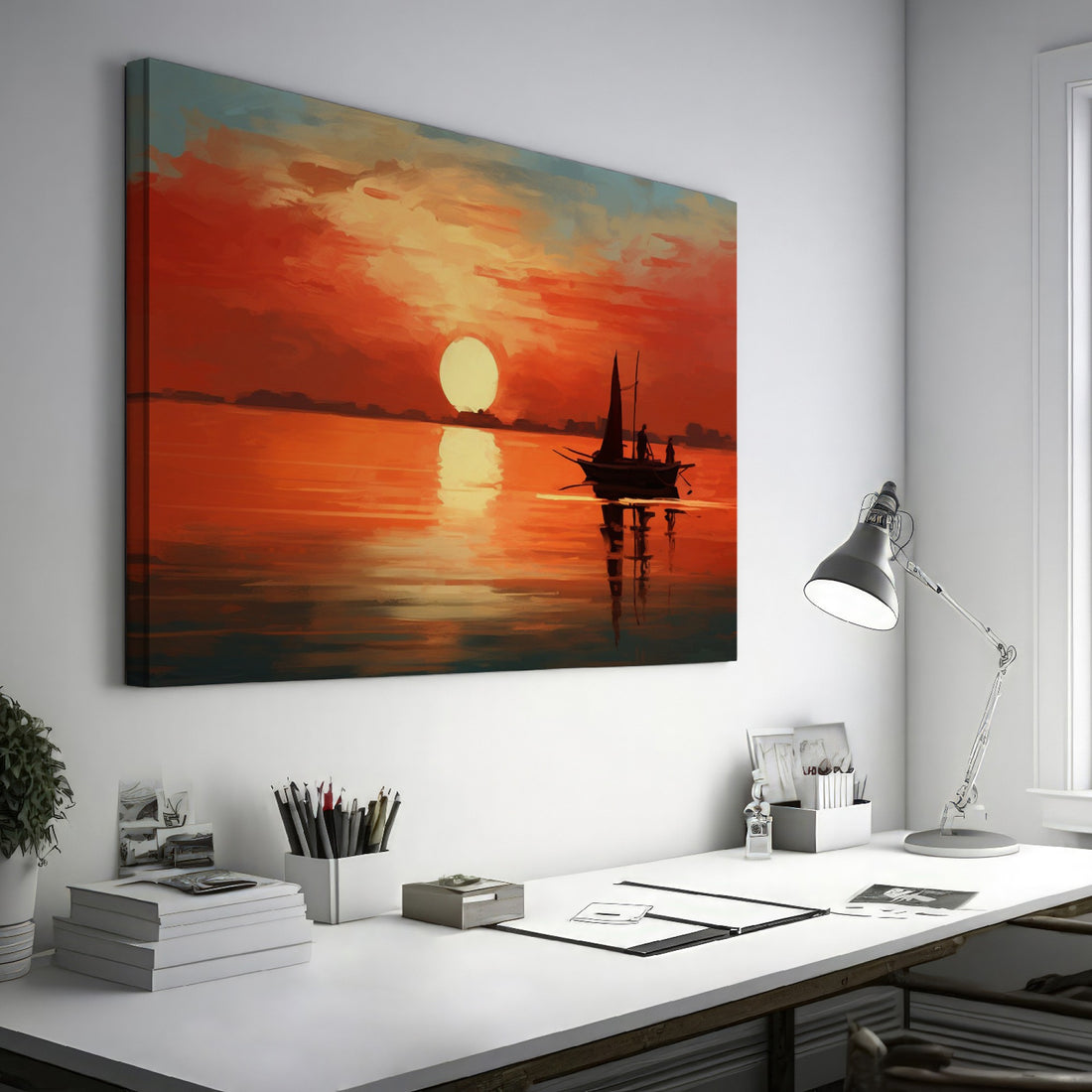 Framed canvas print of a sailboat silhouetted against a sunset with warm red and orange tones