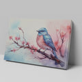 Framed canvas print of a vibrant bluebird on cherry blossom branch in watercolor