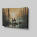 Framed canvas print of deer silhouetted against a forest sunset with reflections on water