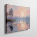 Framed canvas print of an impressionist painting depicting a serene lakeside sunrise with pastel pink and blue hues