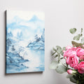 Framed canvas print of a tranquil blue watercolour landscape with misty mountains, silhouetted trees, and flying birds