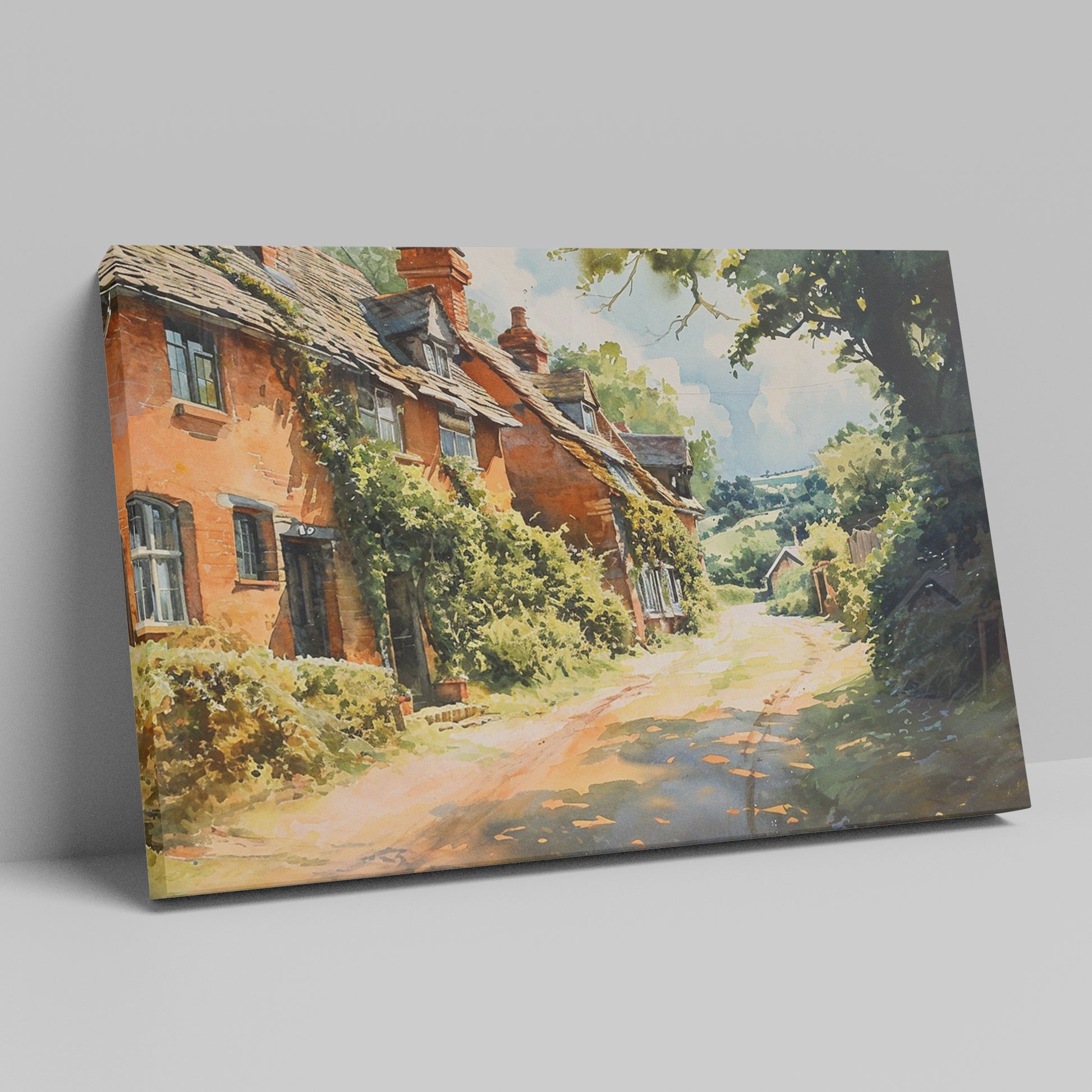 Framed canvas print of English cottage and countryside watercolour scene with lush greenery