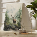 Framed canvas print of a majestic stag set against watercolour misty mountains and a lush forest