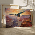 Framed canvas print of a majestic eagle flying over a dramatic canyon landscape at sunset