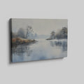 Framed canvas print of a misty river landscape with water reflections in cool tones