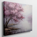 Framed canvas print of an impressionistic cherry blossom tree by a tranquil lake with soft pastel colors