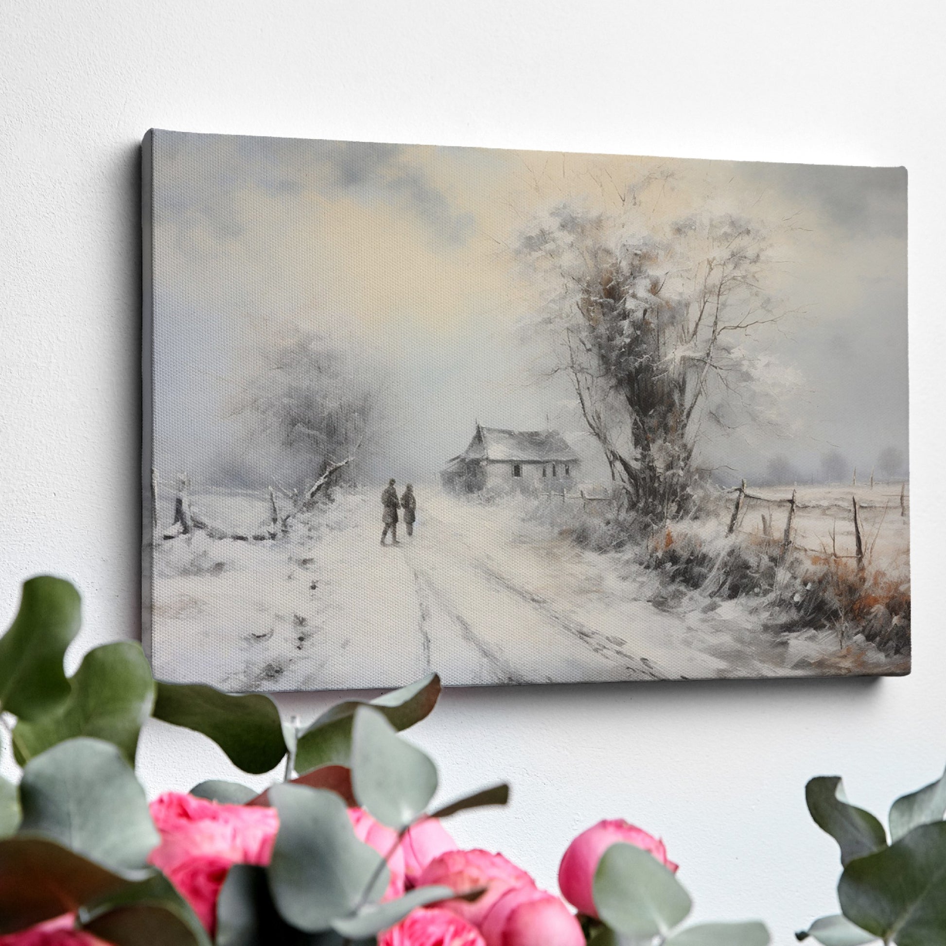 Framed canvas print of a snowy countryside scene with walking figures and a rustic cottage