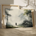 Framed canvas print featuring a solitary figure walking through a misty, ethereal bamboo forest cast in a monochrome colour scheme