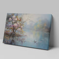 Framed canvas print of impressionist painting with blossoming trees by a serene lake