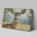 Framed canvas print of a realistic deer in a serene countryside setting with lush foliage