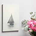 Framed canvas print of a vintage sailboat on a calm sea in monochrome