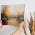 Impressionist painting of a lake with autumn trees and calm water reflections in warm golden and brown tones