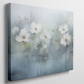 Framed canvas print of serene watercolor flowers with soft blue hues and water reflections