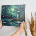 A canvas painting of a lighthouse on a cliff with a swirling starry sky and rough sea in shades of blue and green.