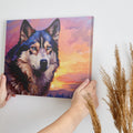 Framed canvas print of a stylized geometric husky against a colourful sunset