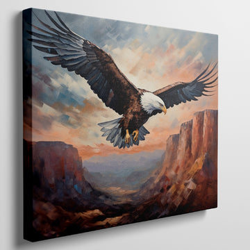 Framed canvas print of a majestic eagle soaring over a canyon at sunset