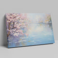 Framed canvas print of a serene impressionist painting with cherry blossoms and river reflections