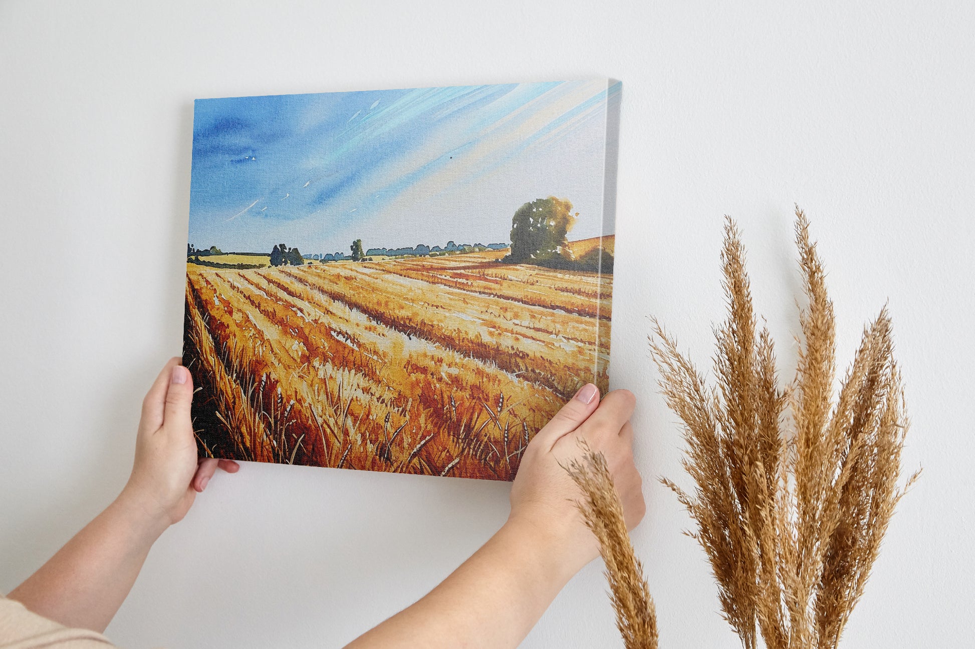 Framed canvas print of golden wheat fields under a blue sky in a rural landscape