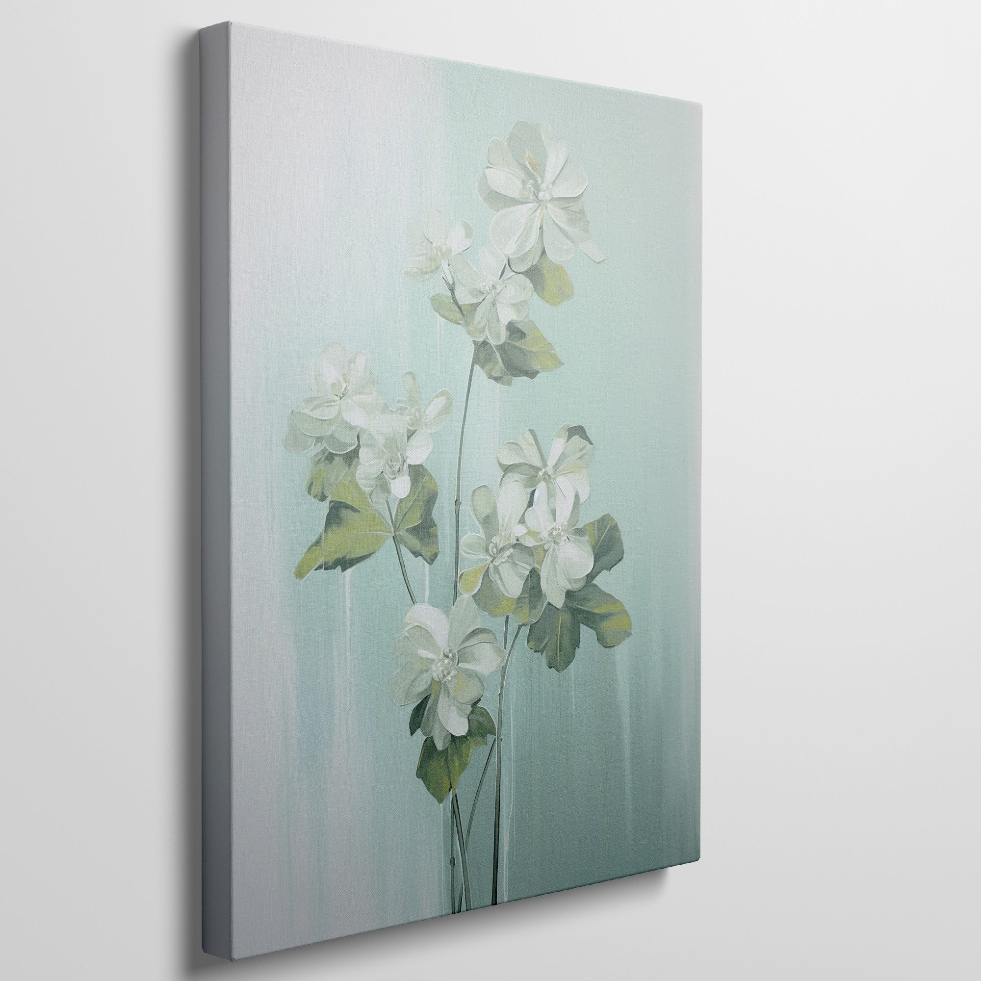 Framed canvas print of white blossoms with green leaves on a soft blue background