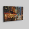 Framed canvas print of an impressionistic cityscape at twilight with a café terrace and bustling streets