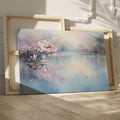 Framed canvas print of cherry blossoms over a tranquil lake with soft pastel colours and a pair of ducks