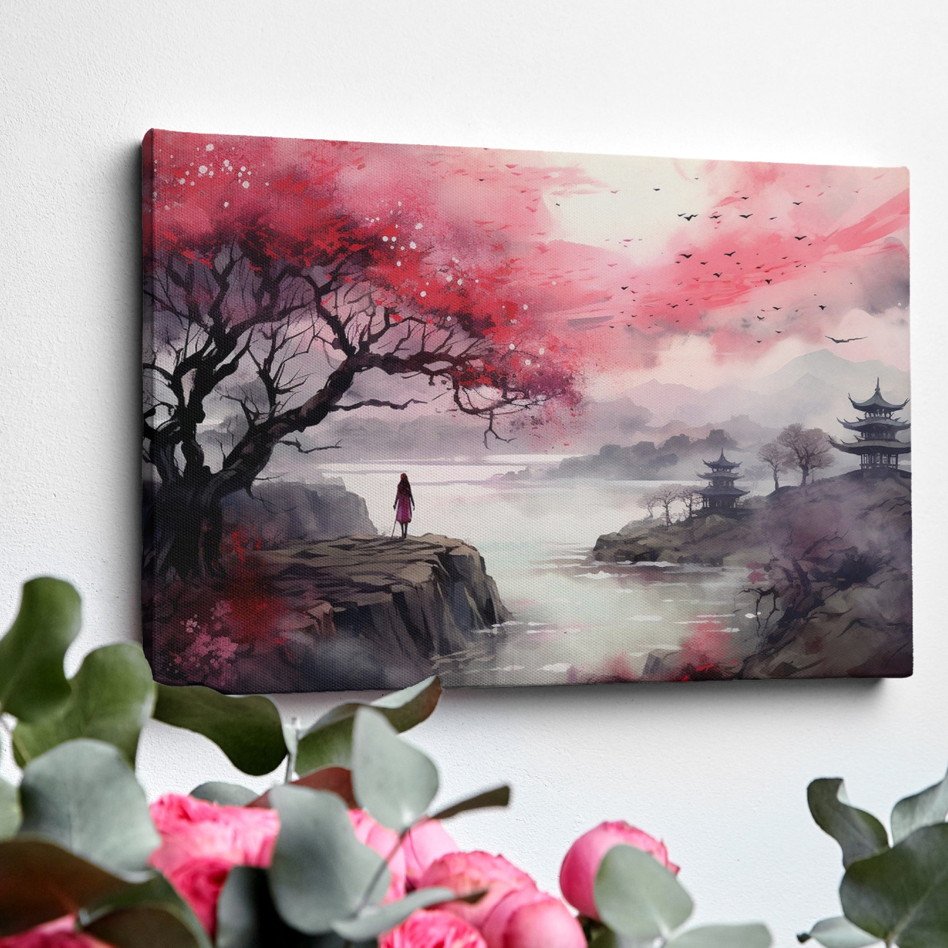 Framed canvas print of an oriental landscape with cherry blossoms, pagodas, and a silhouette of a person