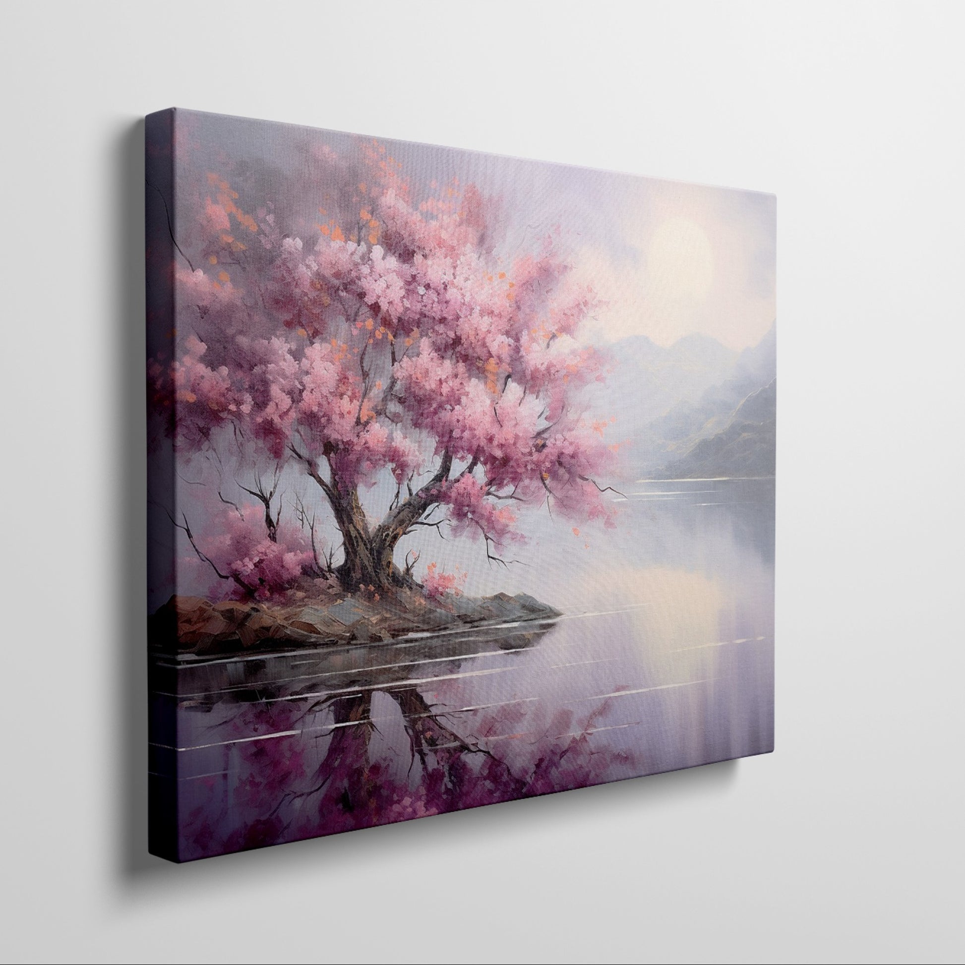 Framed canvas print of a cherry blossom tree by a tranquil lake at dusk with mountains in the background, reflecting soft pink and purple hues