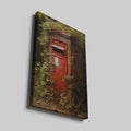 Framed canvas print of a vintage British red postbox entwined with green foliage in a forest