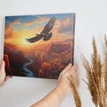 Framed canvas print of a majestic eagle flying over a sunset-lit river canyon