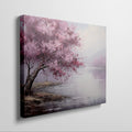 Framed canvas print of an impressionistic cherry blossom tree by a tranquil lake with soft pastel colors