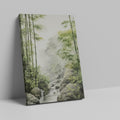 Framed canvas print of a misty bamboo forest with a gentle waterfall and rocks