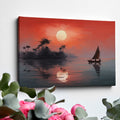 Framed canvas print of a tropical sunset with silhouette of sailboat and palm trees reflection on the water