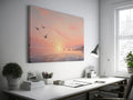 Framed canvas print of a serene seascape at sunset with flying birds and calm ocean waters