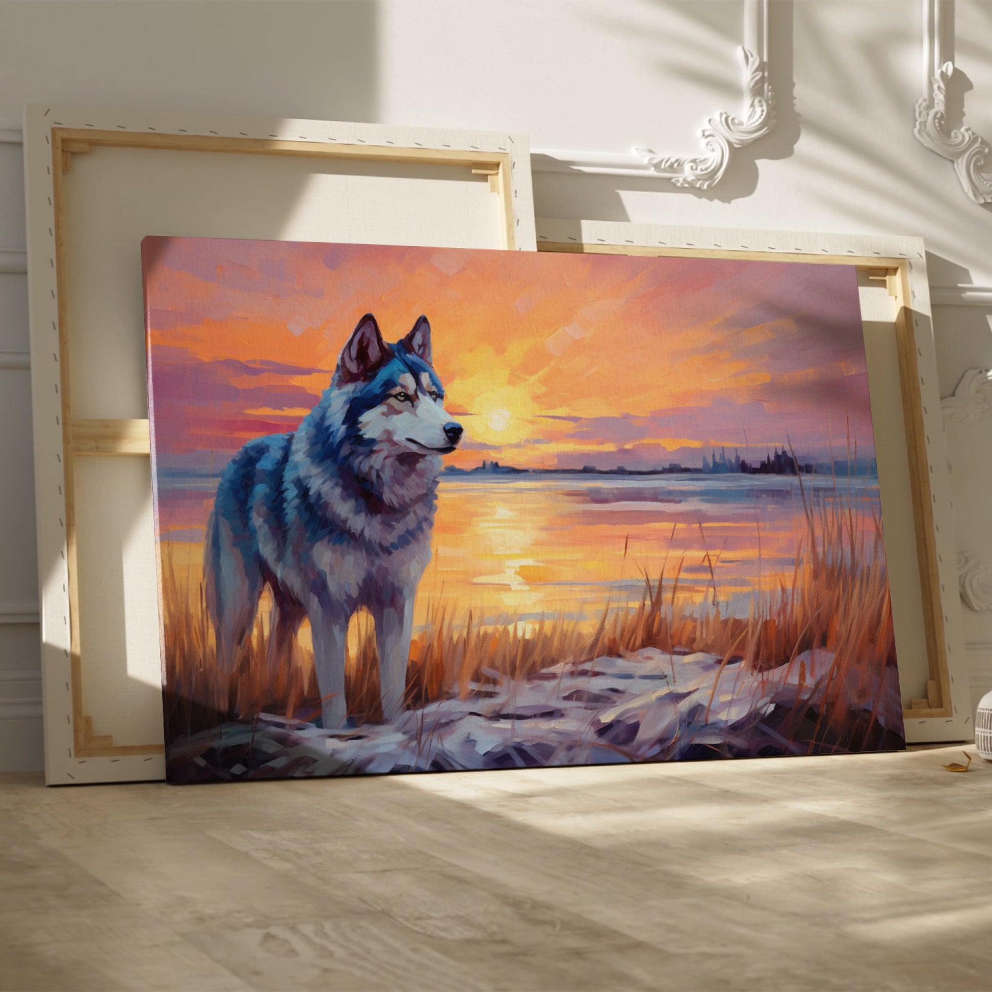 Framed canvas print of a Husky in silhouette against a colourful sunset with reflection on water