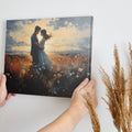 Framed canvas print of a couple embracing in a field at sunset with vibrant colours