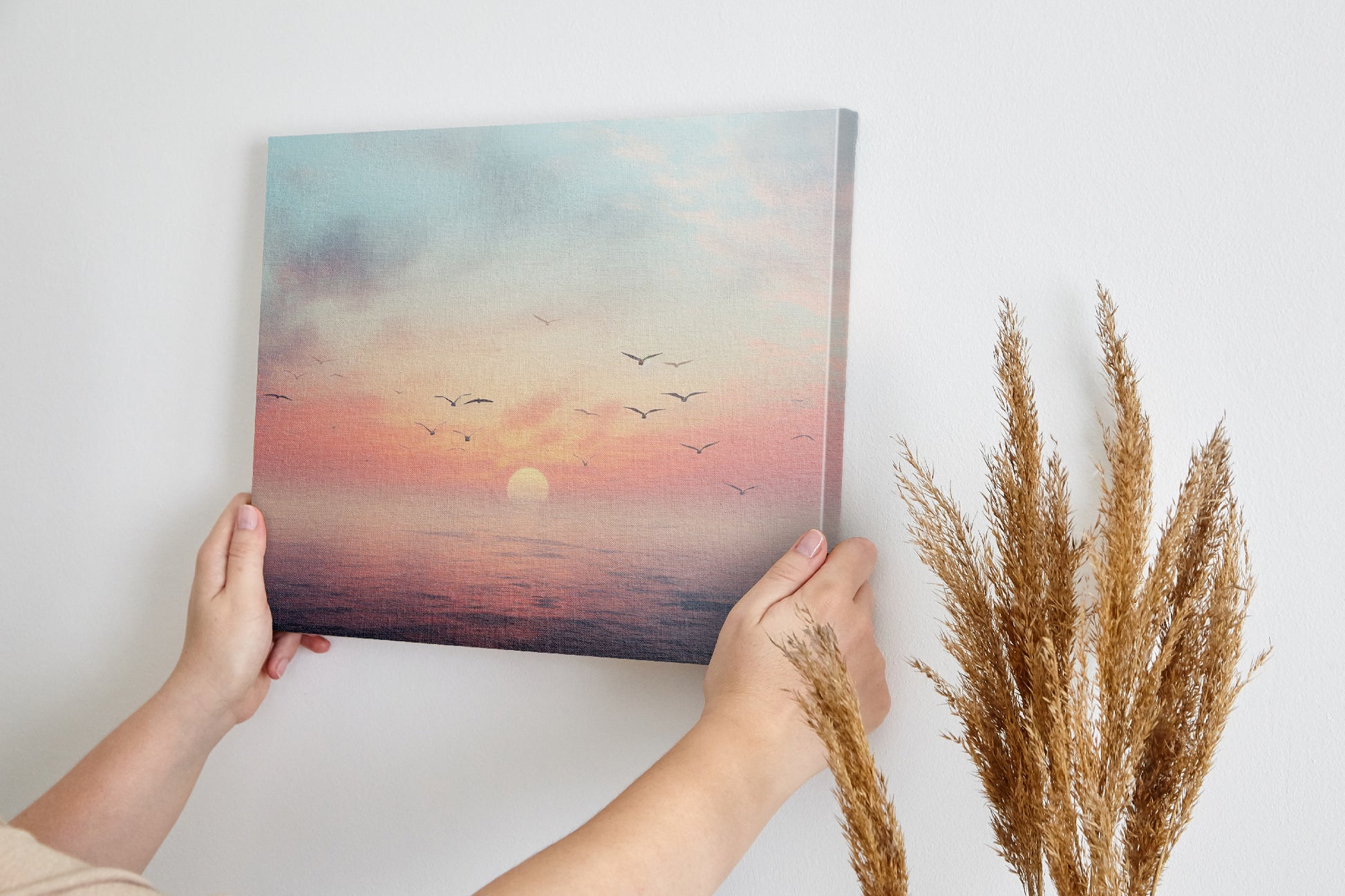 Framed canvas print of a tranquil seascape at sunset with birds and pastel skies