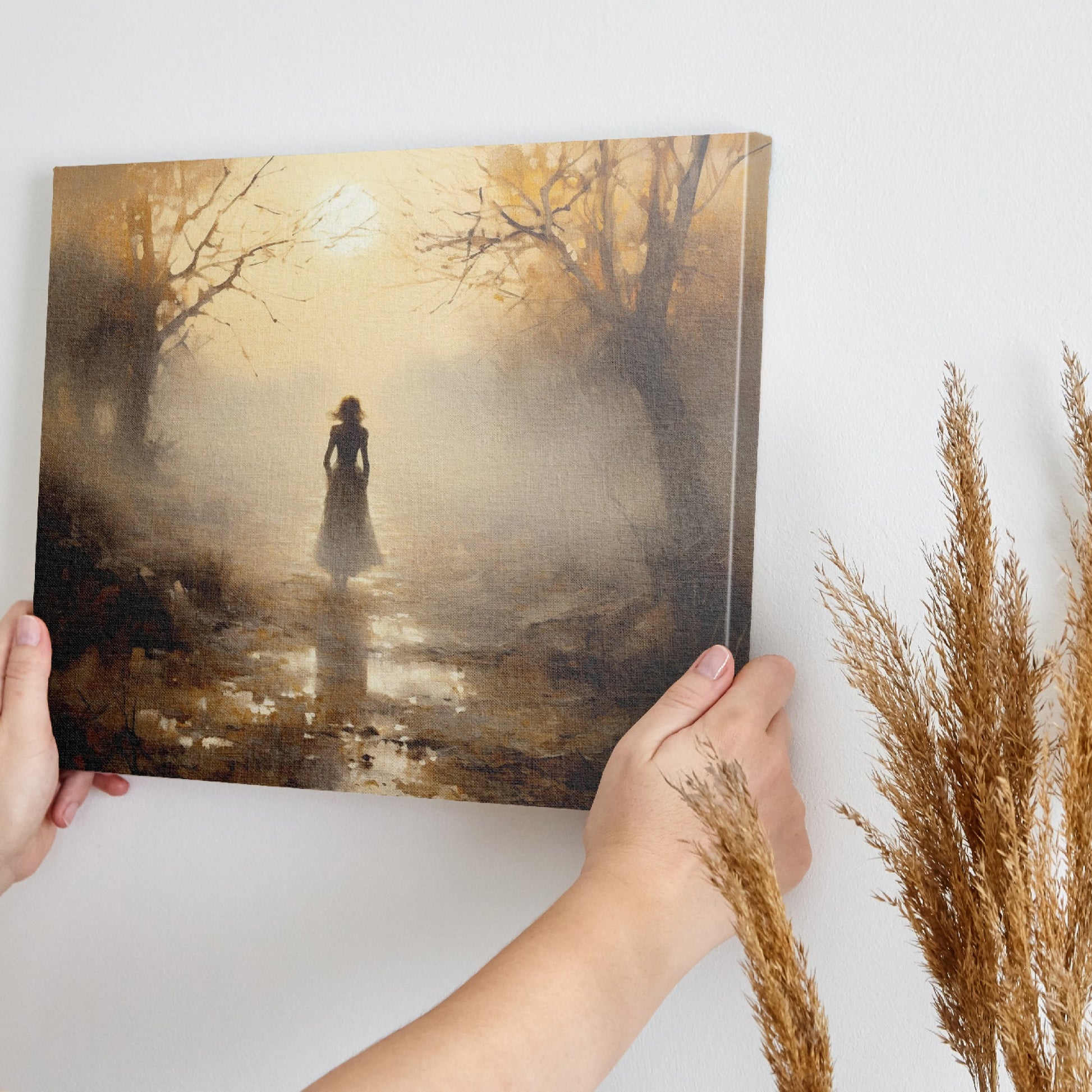 Framed canvas print of a mystical autumnal pathway with a silhouette of a woman walking, surrounded by golden trees and a soft fog.