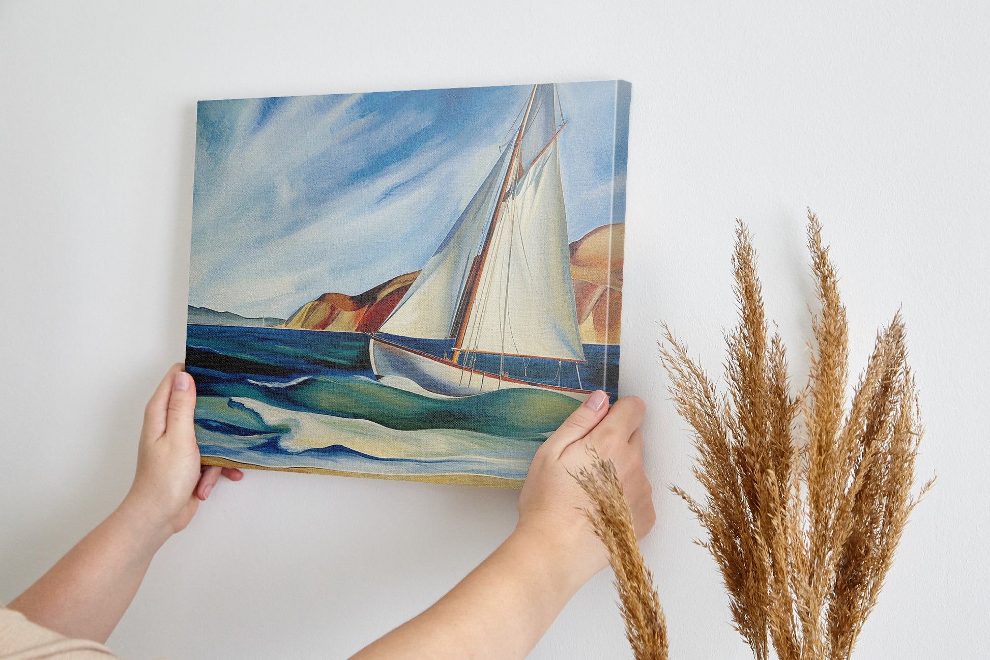 Framed canvas print of a vibrant sailboat sailing near a coastline with blue skies