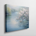 Framed canvas print of serene riverscape with cherry blossoms in impressionist style