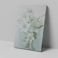 Framed canvas print of delicate white blossoms with a pastel background