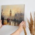 Framed canvas print of London's Big Ben and red buses in an abstract impressionist style with warm golden colours