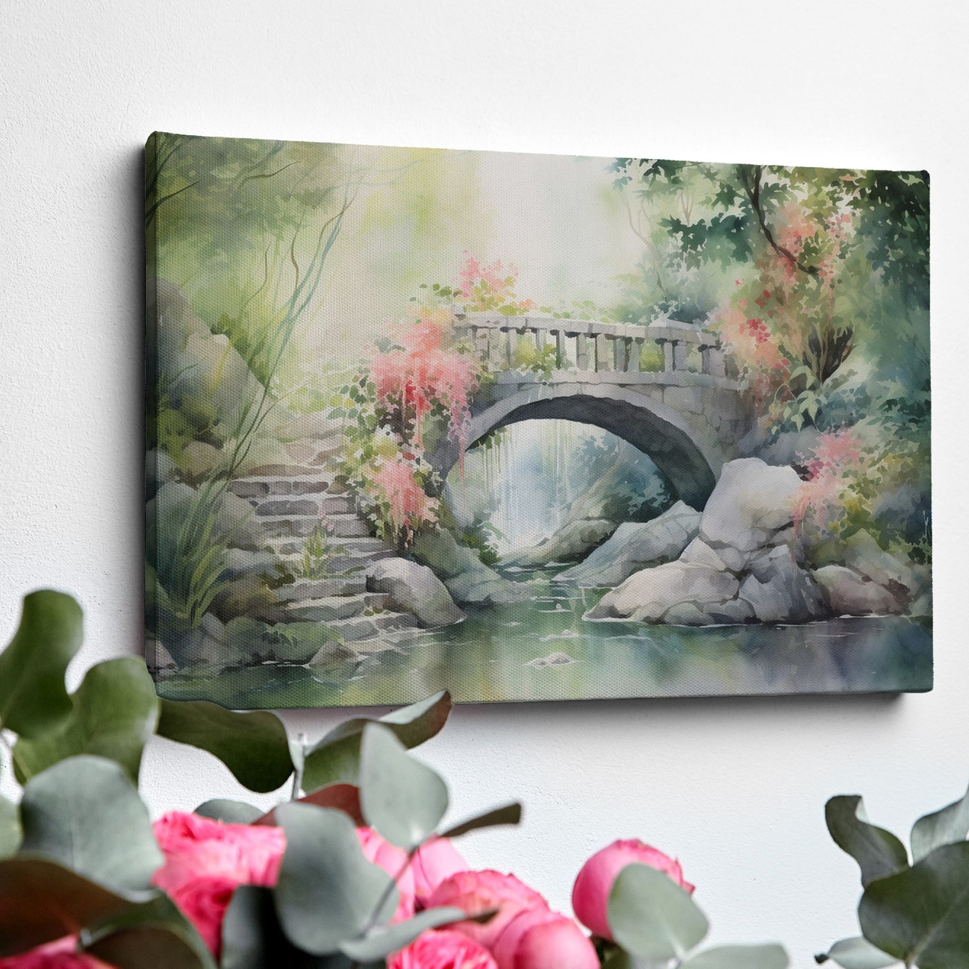 Framed canvas print of a serene stone bridge over a stream in a misty garden with lush greenery and flowering plants