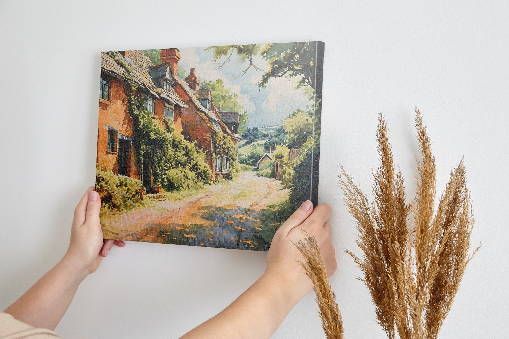 Framed canvas print of English cottage and countryside watercolour scene with lush greenery