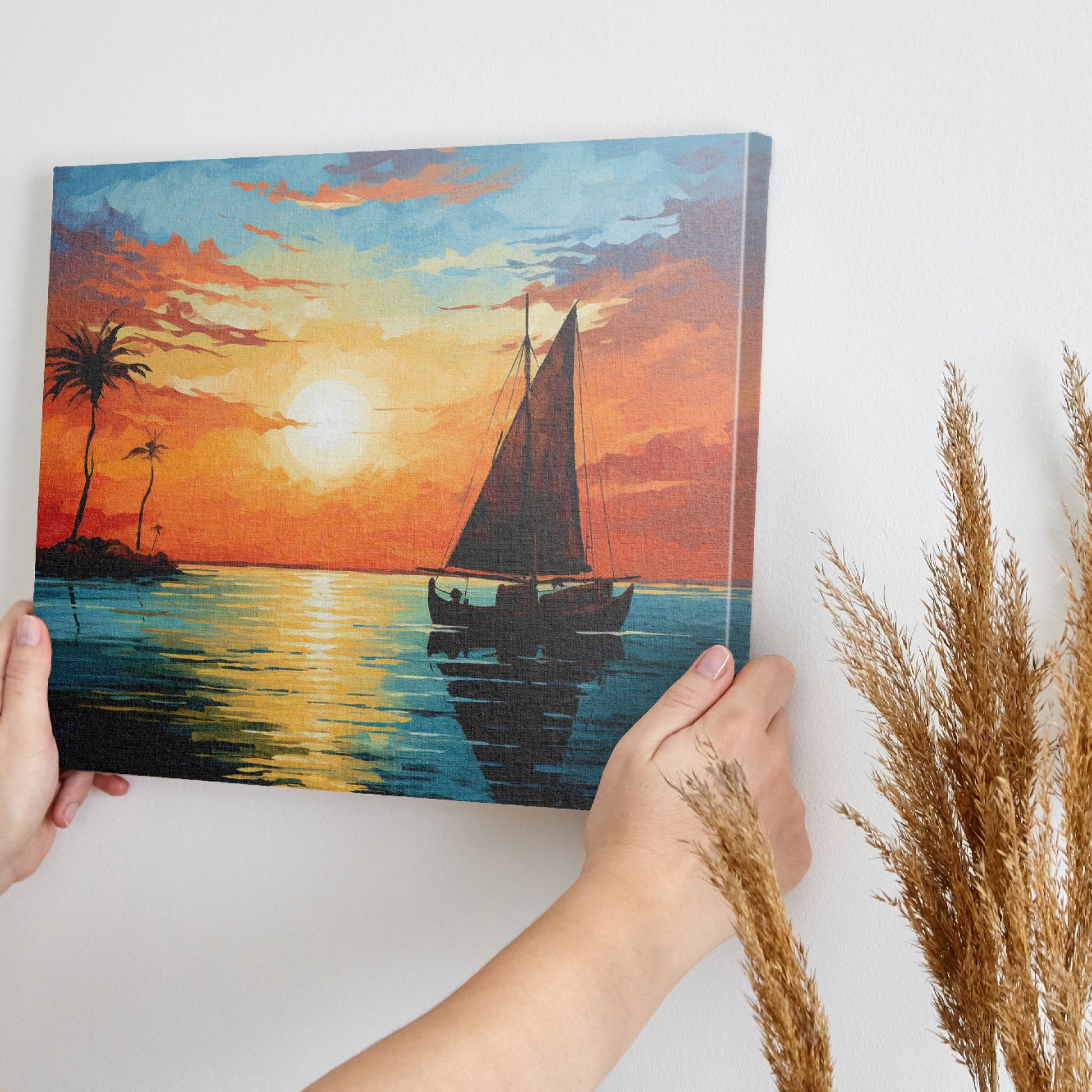 Framed canvas print of a tropical sunset with a sailboat and palm trees