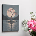 Framed canvas print of a minimalist scene with a lone tree, red leaves, and a moonlit lake