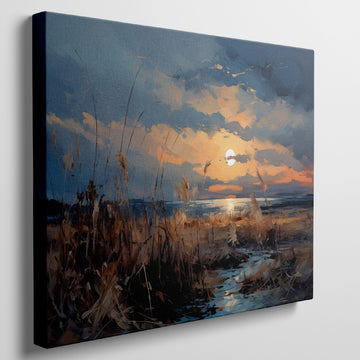 Framed canvas print of an impressionistic sunset over a coastal landscape with vibrant warm hues