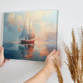 Framed canvas print of an impressionist depiction of a sailboat at sunset with vibrant sky and water reflections