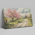 Framed canvas print of a picturesque countryside with cherry blossoms and a farmhouse